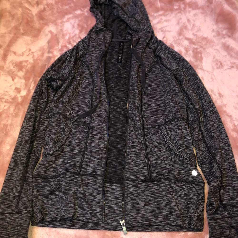 A tight fitting zip up sweatshirt